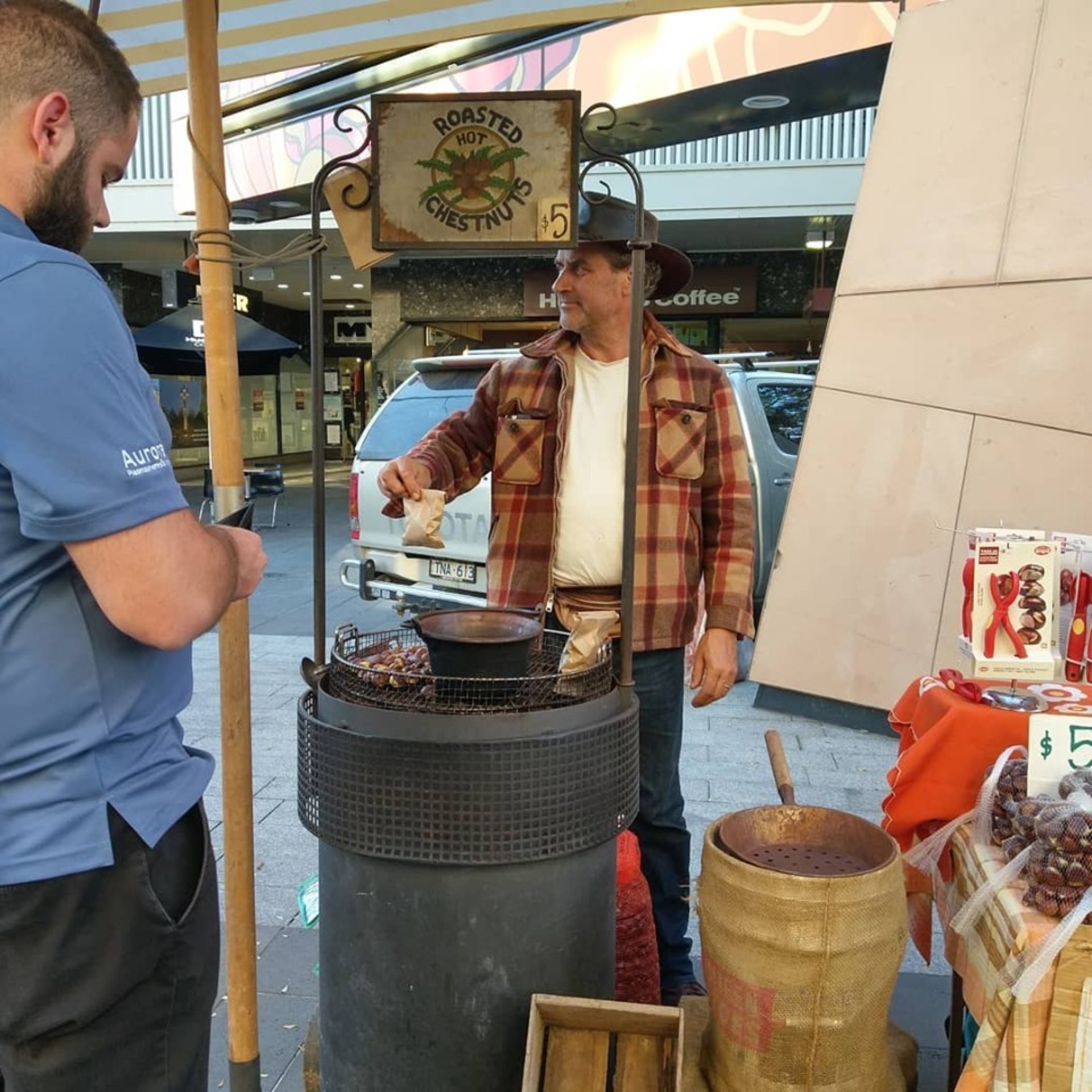 Stallholder selling chestnuts at Bendigo Farmers Market